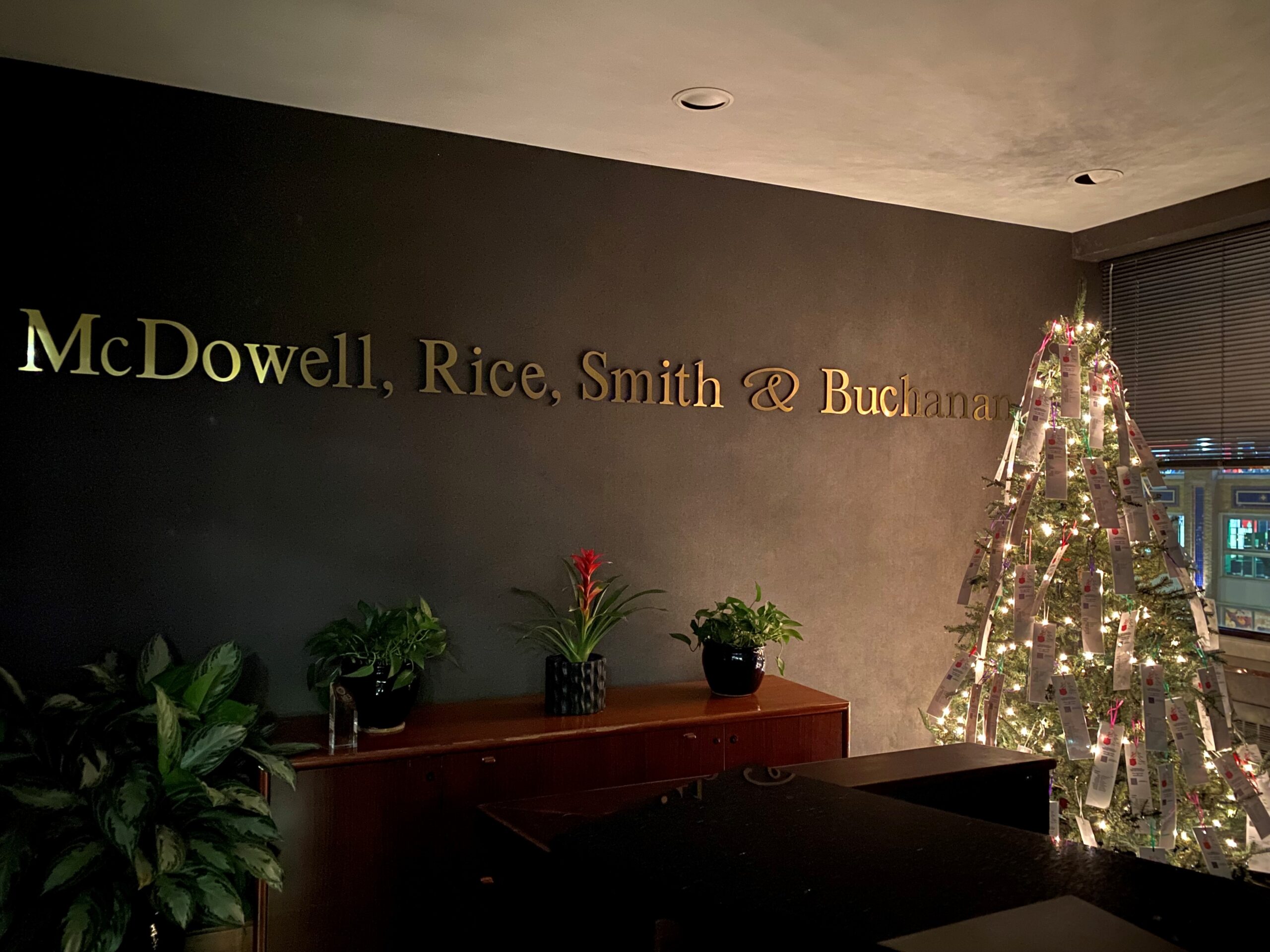 the office lobby with christmas tree for the 2024 holiday